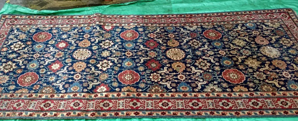 A patterned blue oriental rug after cleaning
